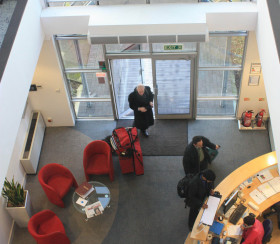 Office using an air curtain for heat retention