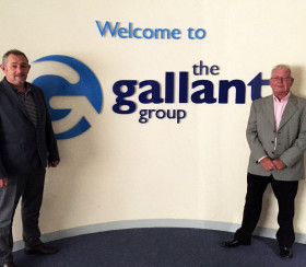 Welcome to the Gallant Group sign with representatives