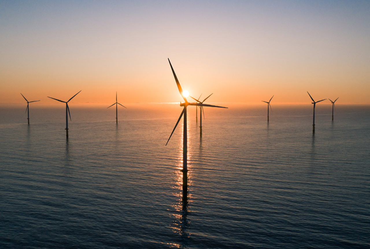 offshore wind turbines at sunrise